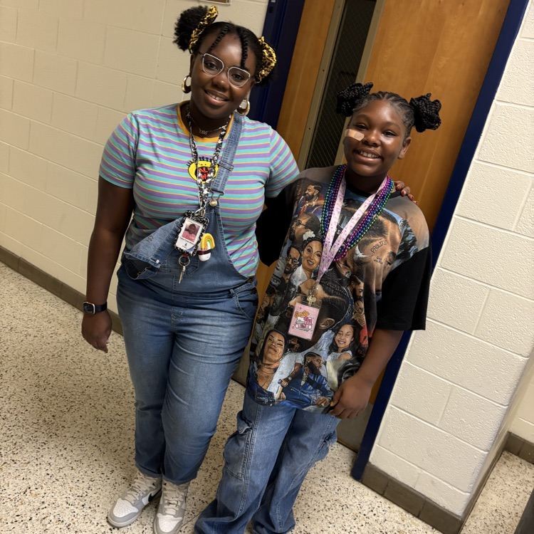 teacher and students dressed in decades gear