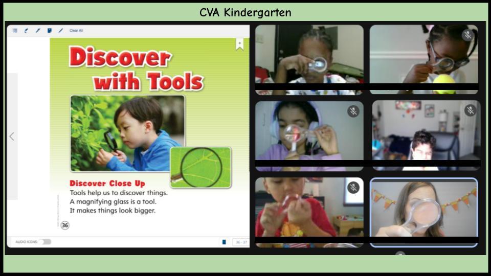 children looking through magnifying glass