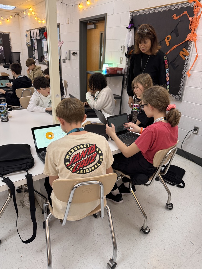student working on designing a pumpkin using tinkercad