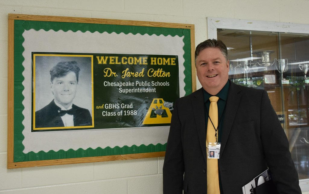 Dr. Cotton posing at his alma mater, Great Bridge High