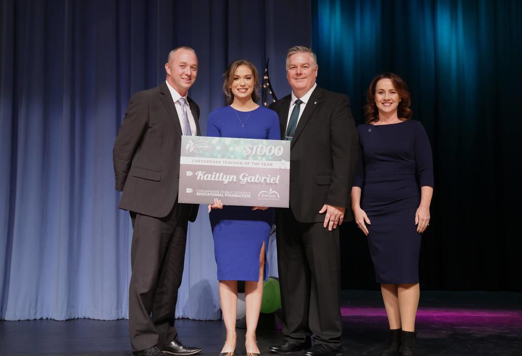 Dr. Cotton poses with the Teacher of the Year winner
