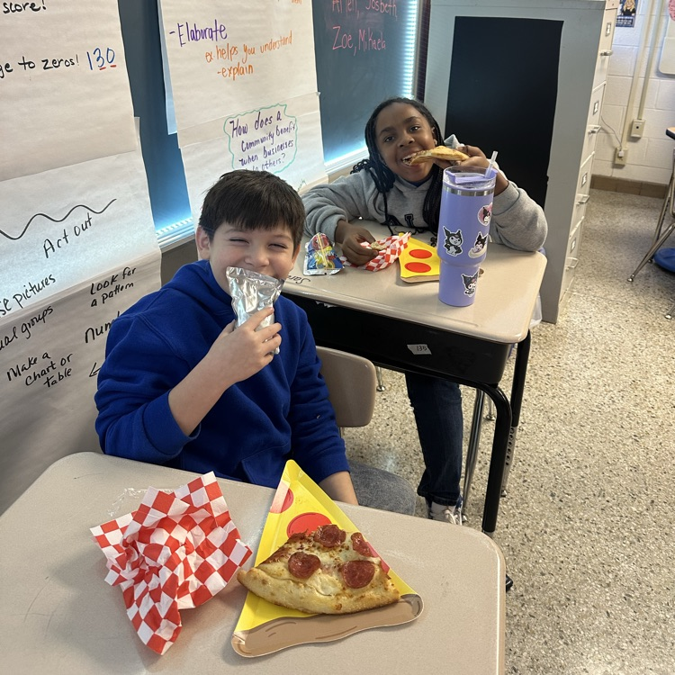 students with pizza and pizza plates