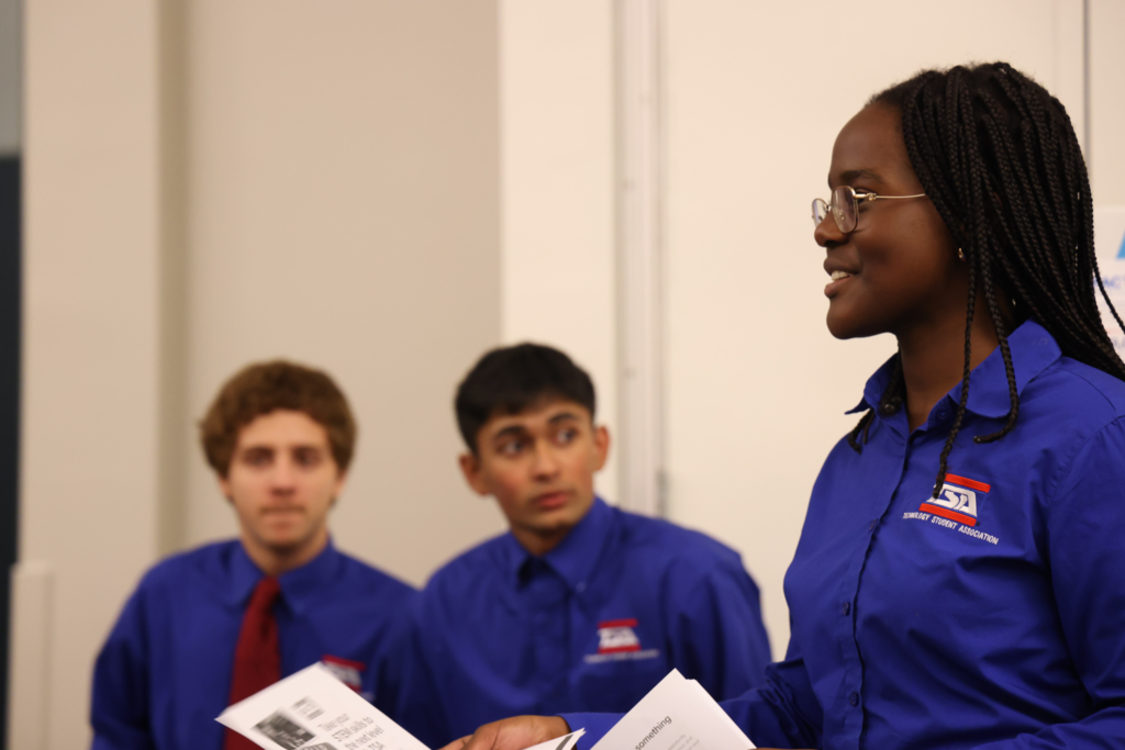 femal student TSA speaking with guests