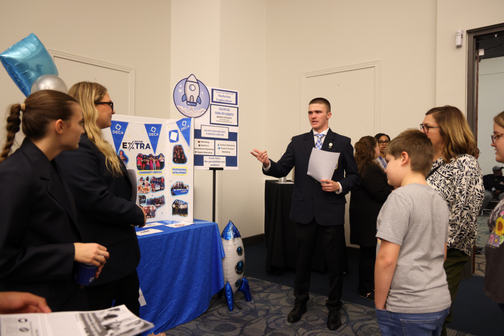 male stdent presenting for DECA