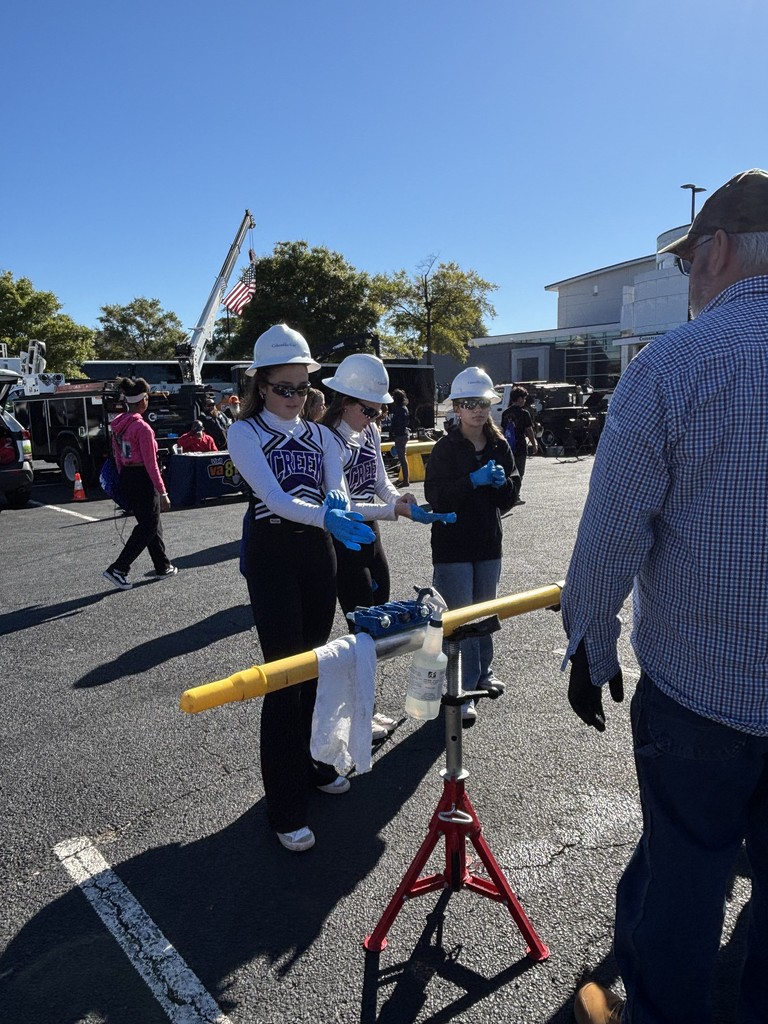 Student outside in hard hats learning about career readiness opportunities