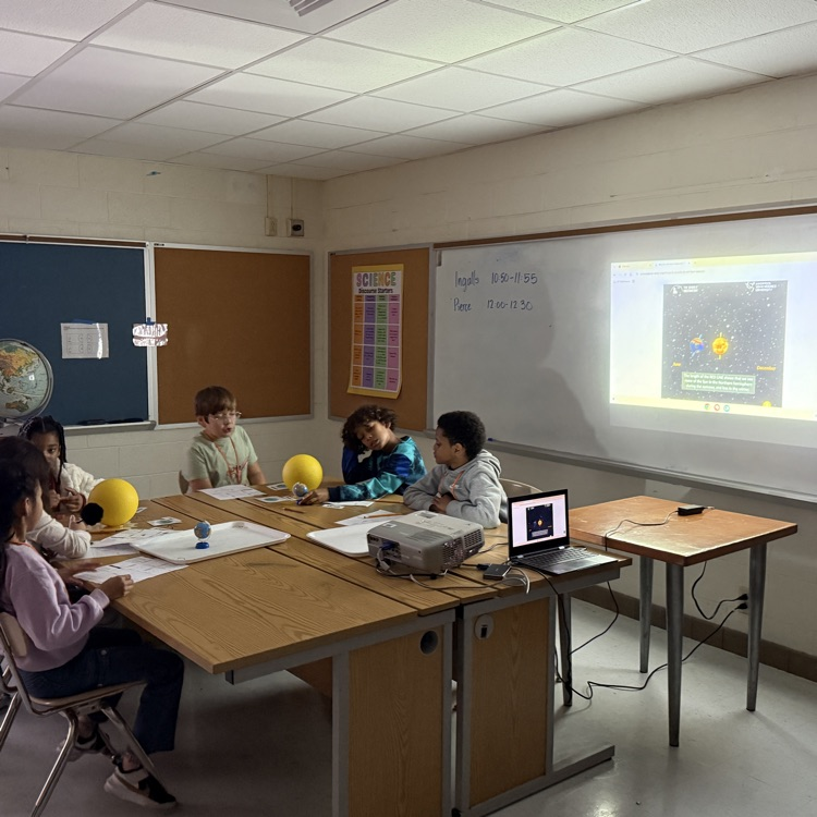 students with models of seasons 