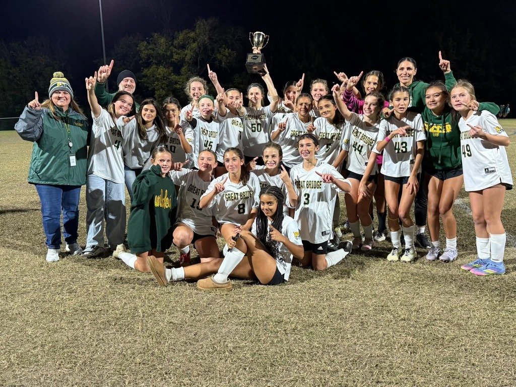 The girls Soccer team poses for a picture following their win in the city championship game.