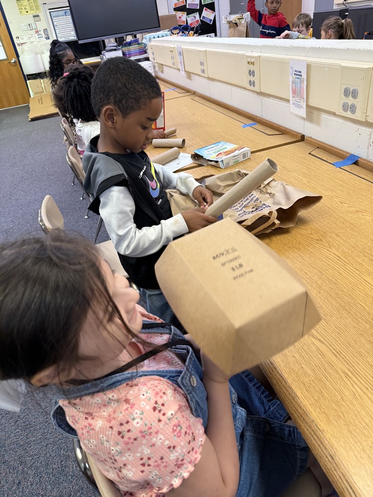 students building their sun-blocking structures