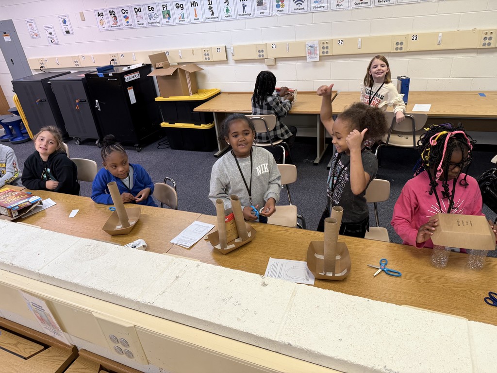 students building their sun-blocking structures