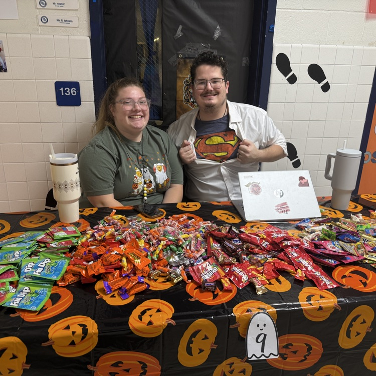 Clark Kent costume with candy on the table 
