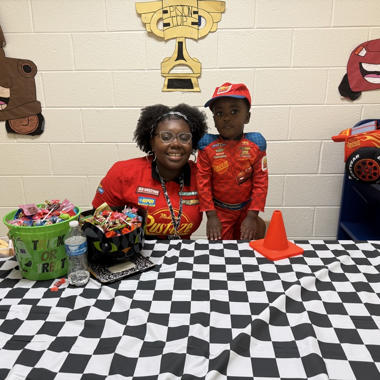 Race car driver costumes and “cars” table 