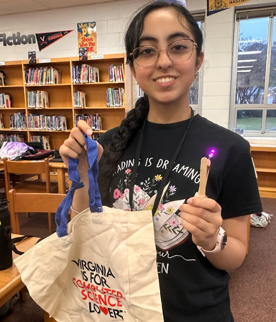 A girl showing her prize at the conference.