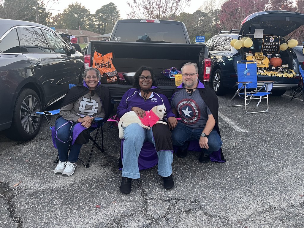 Mrs. Davenport, Dr. Page, and Mr. Smith at a trunk or treating