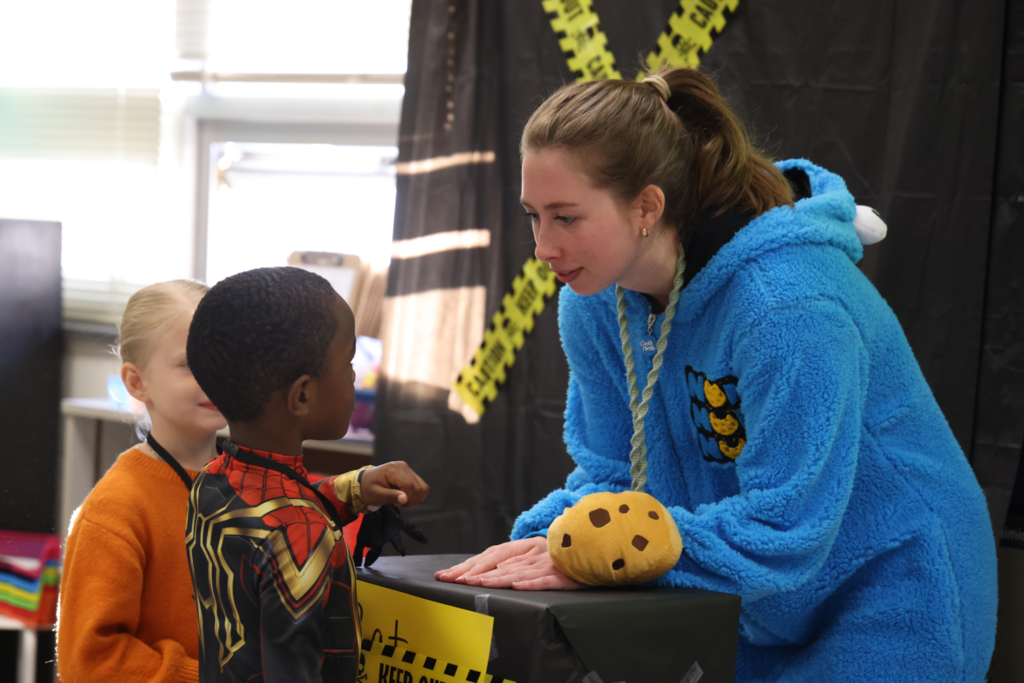 teacher helping student in fear factor challenge