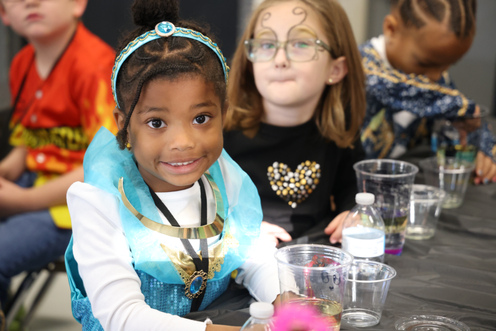 Little girl dressed as jasmine smiling