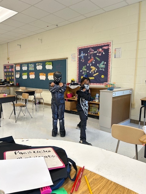 students dressed as black panther (left) and ninja (right)