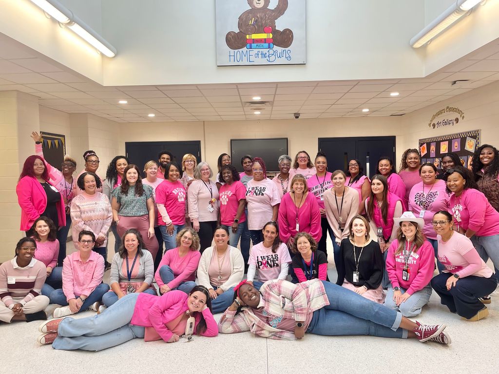 staff wearing a pink