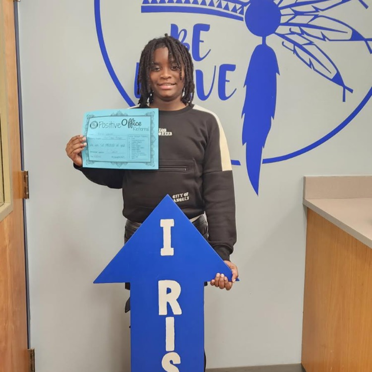 student with I RISE sign