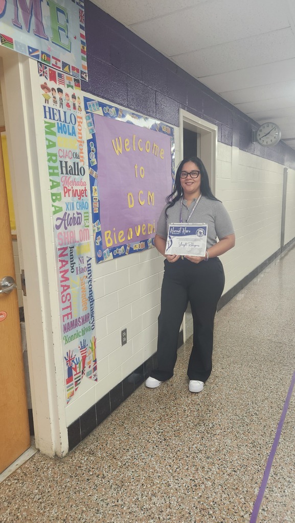 Mrs. Rodriguez holding her award. Hornet Hero.