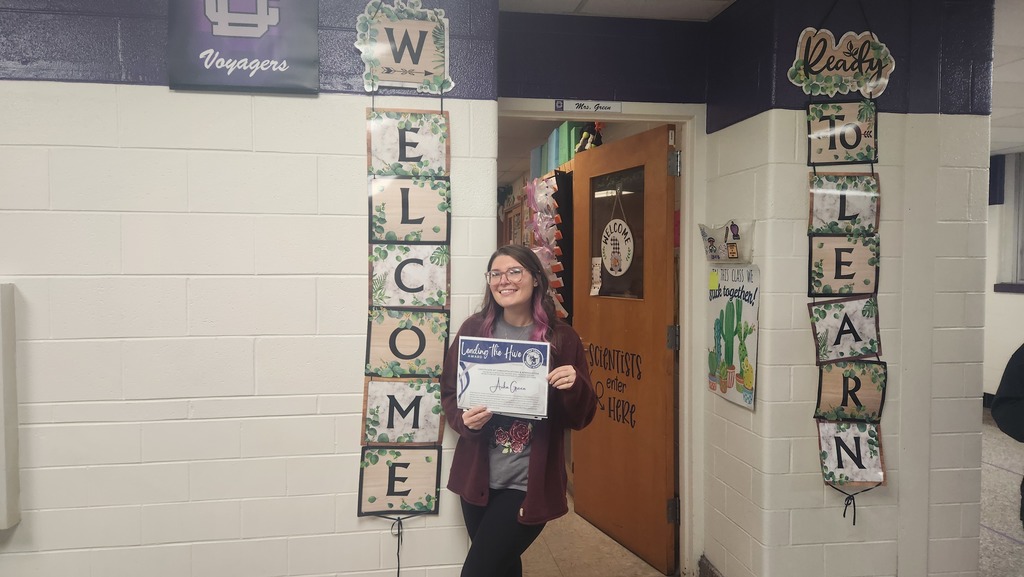 Mrs. Green holding her Leading the Hive Award