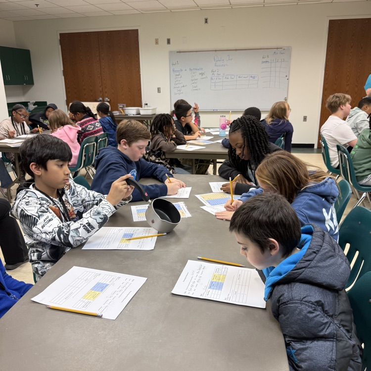 classroom fill with students completing labs