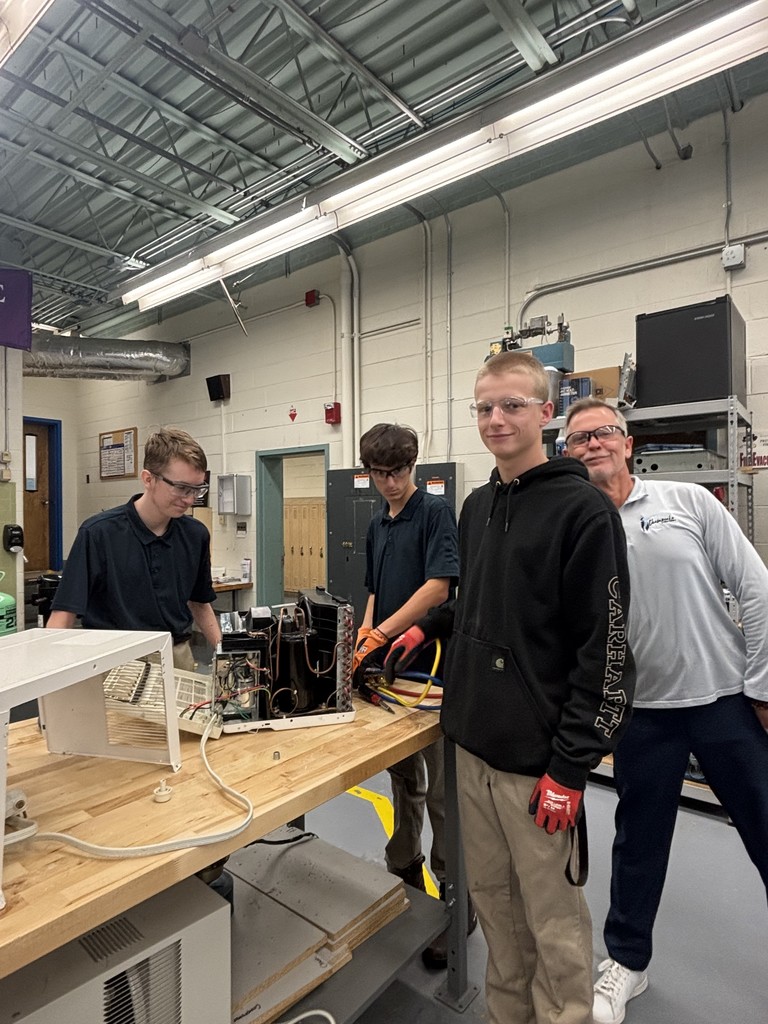 HVAC students fixing mini motor