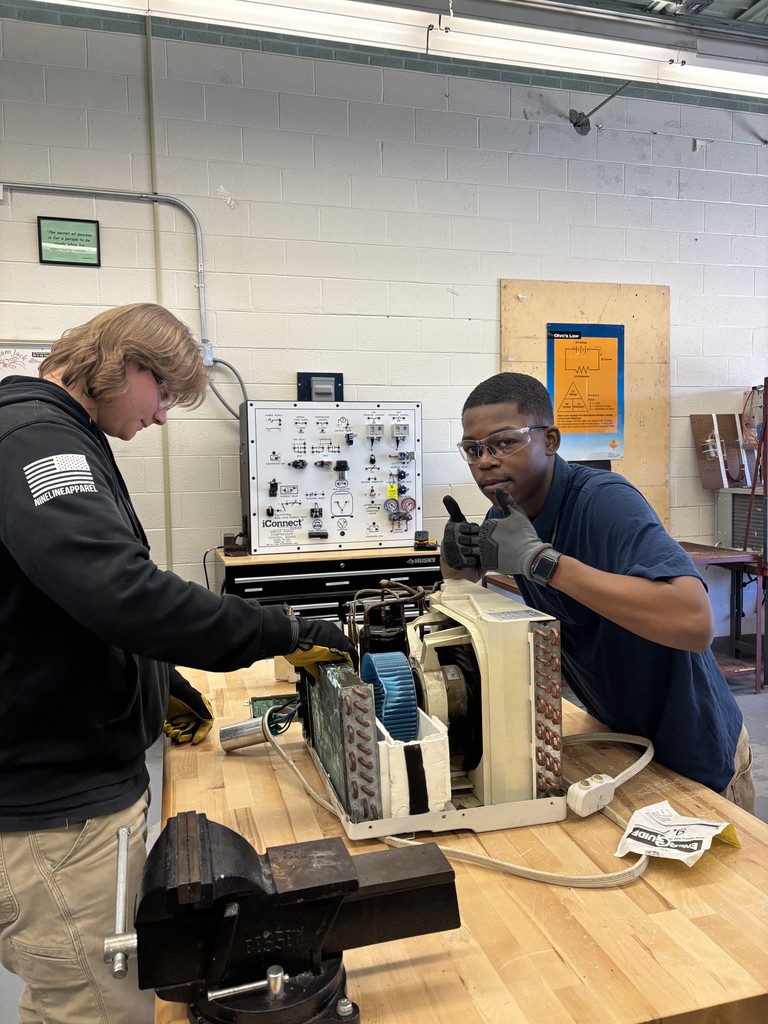 HVAC students fixing mini motor