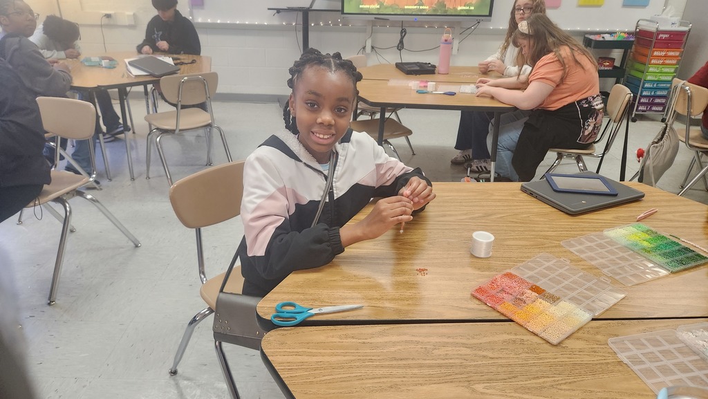 a student in the bracelet making club