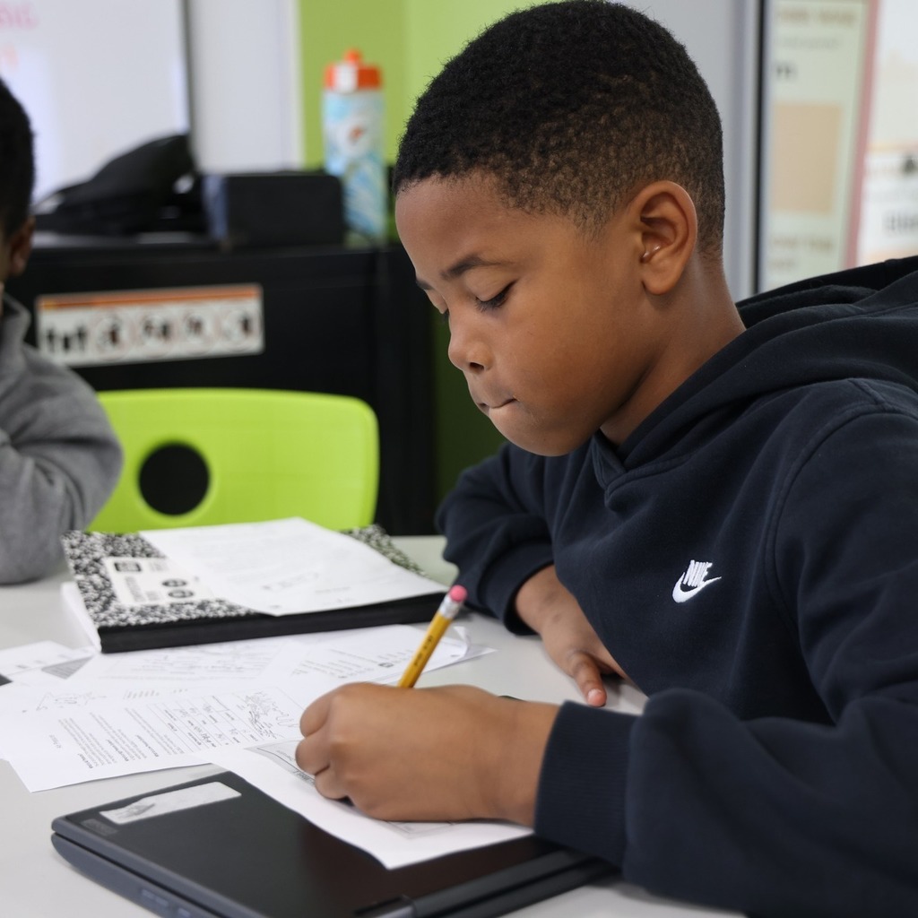 Student writing data.