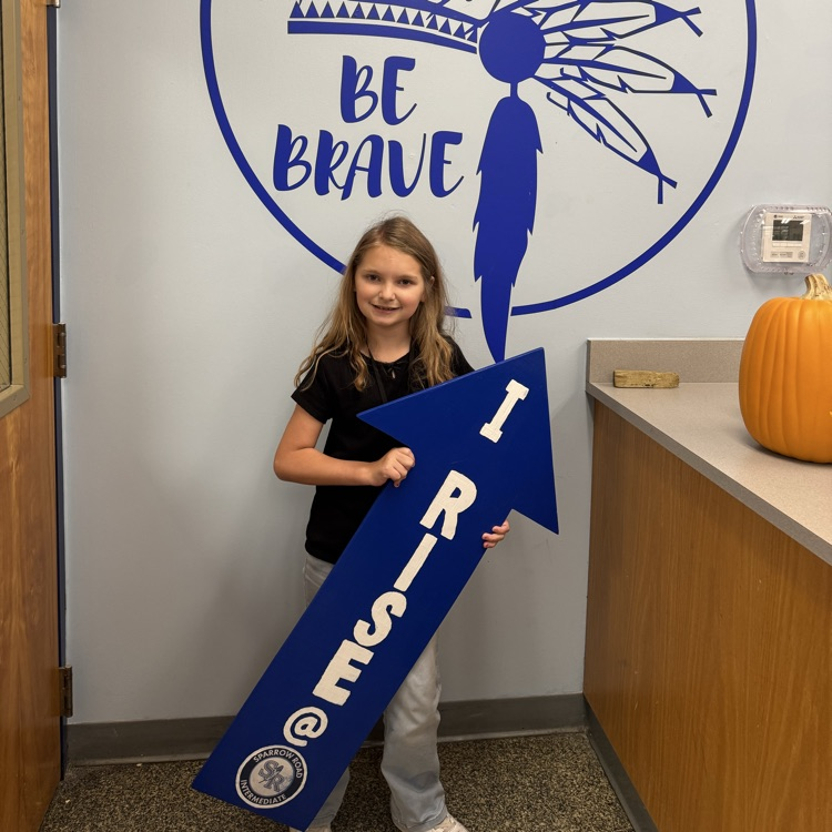 Student with I RISE sign