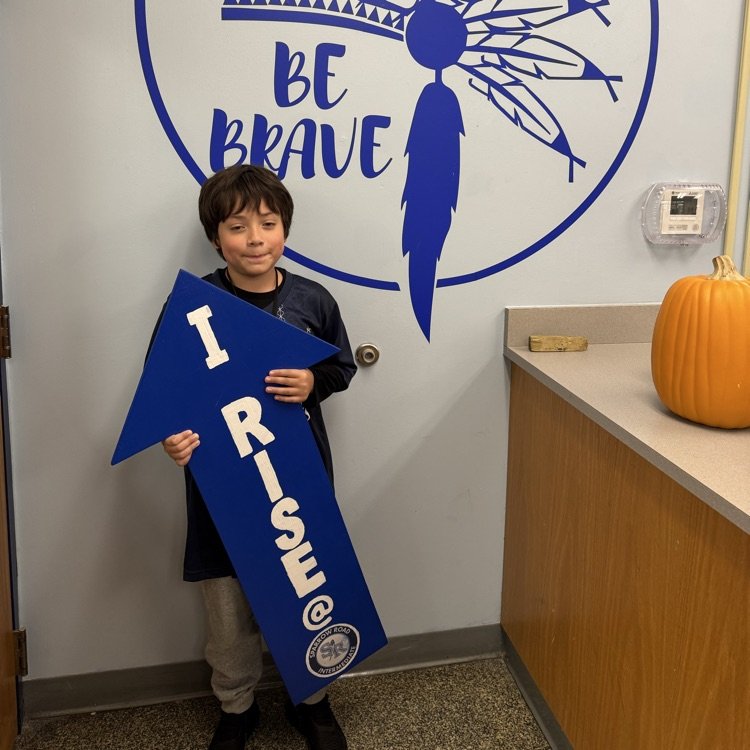 Student with I RISE sign