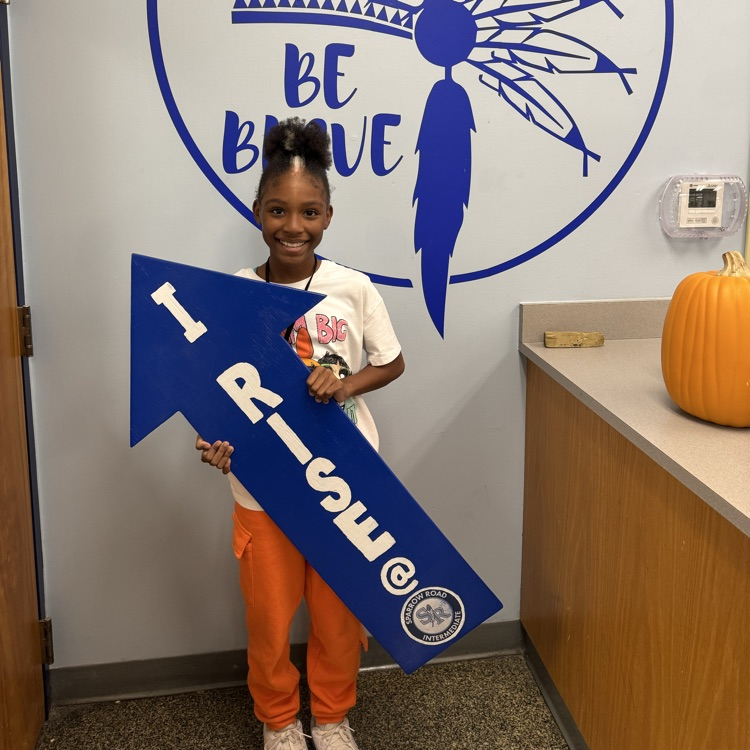 Student with I RISE sign