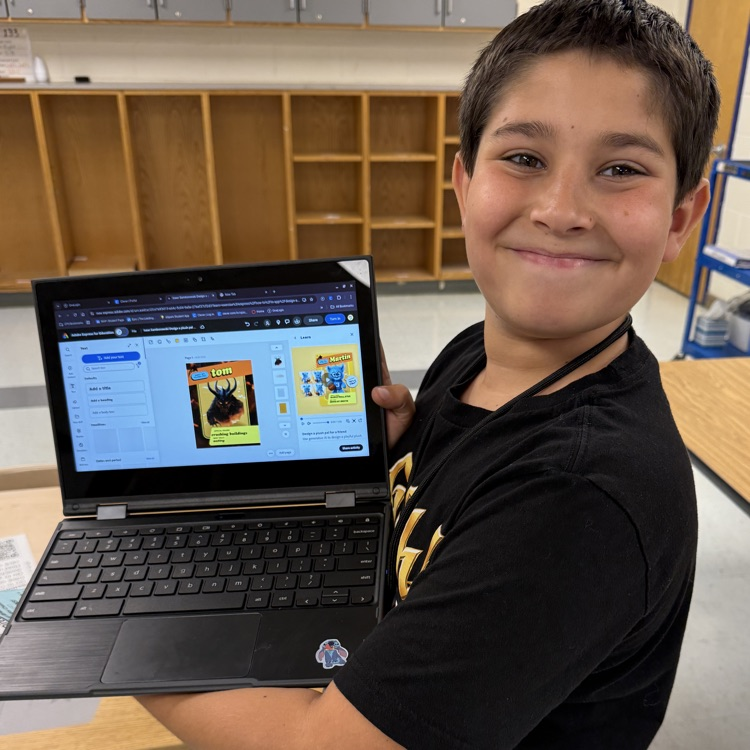 student holding computer with plush pal on it