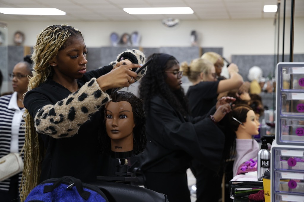4 CCC students practicing hair