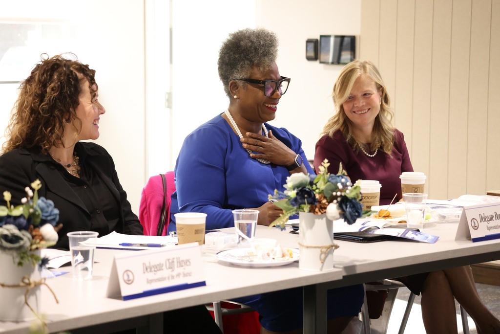 Members of the Chesapeake Delegation laughing together.