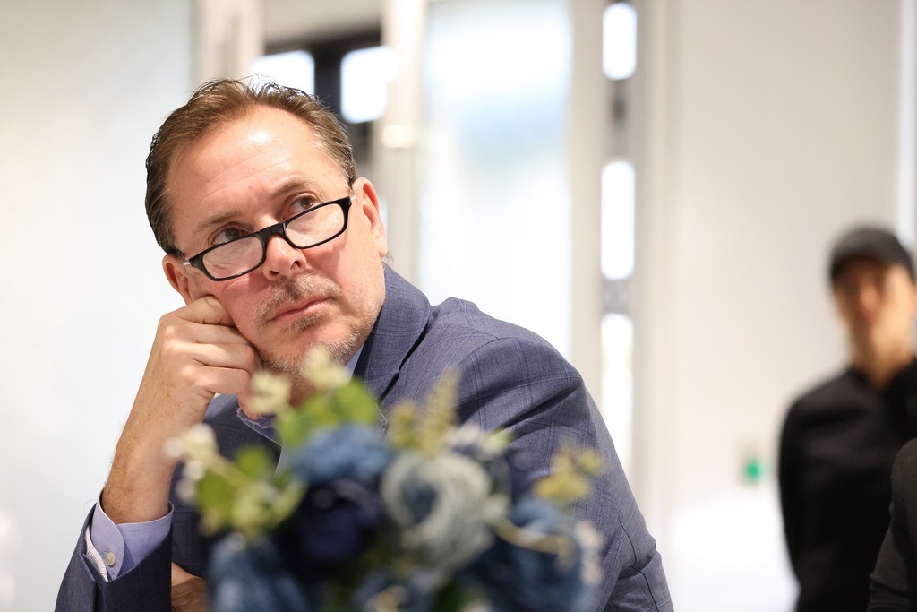 Jay Leftwich looking at a presentation.