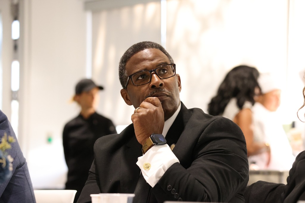 Delegate reviewing the presentation at the legislative breakfast.