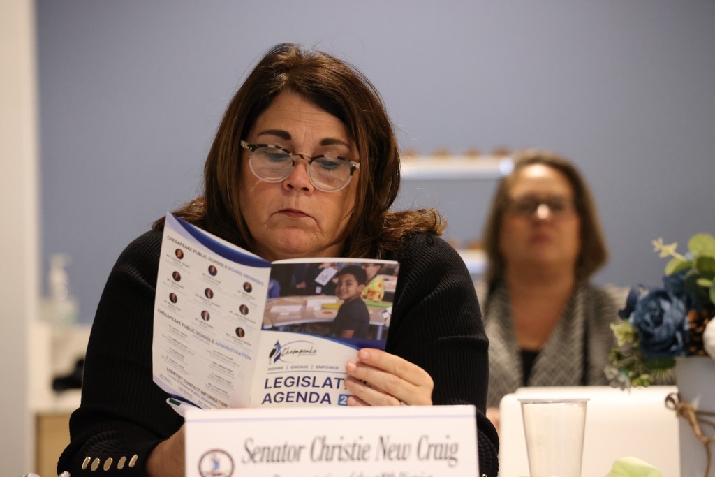 Delegate reviewing the Legislative Agenda.