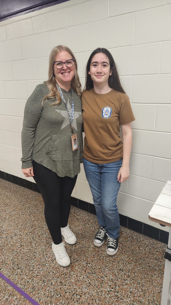 A teacher and a student representing military families with their spirit wear