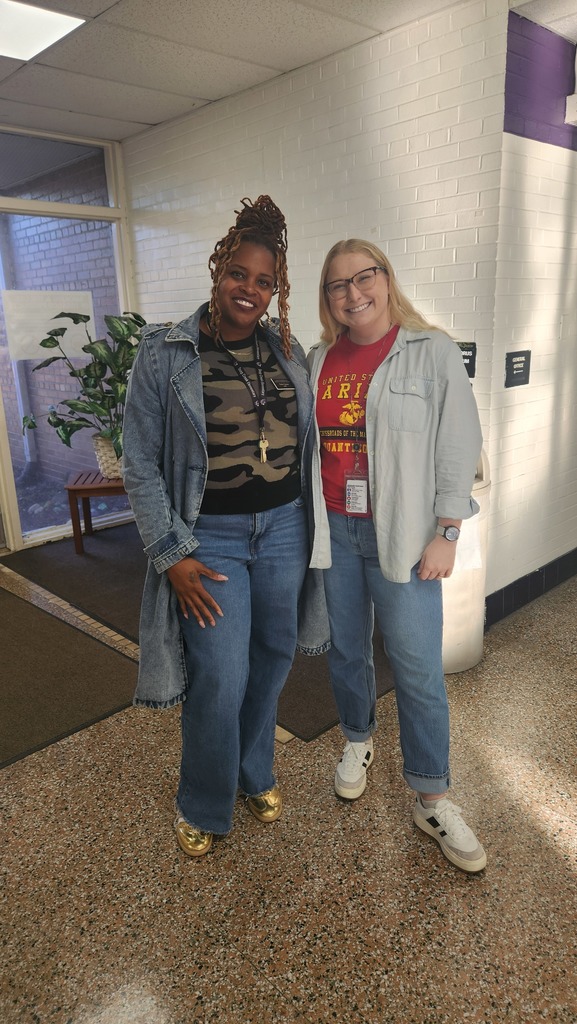 Two teachers representing military colors