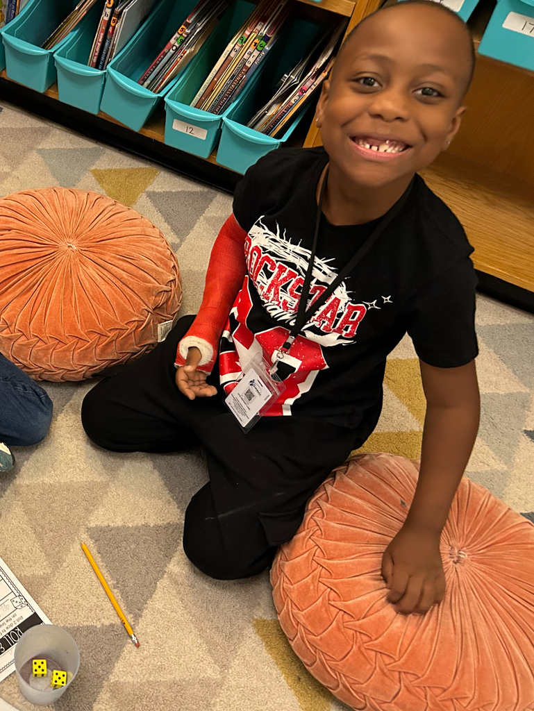 student plays roll and compare to practice comparing numbers