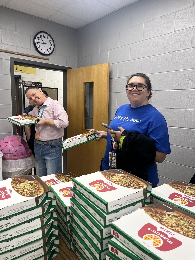 Educators with pizza from Marco's Pizza