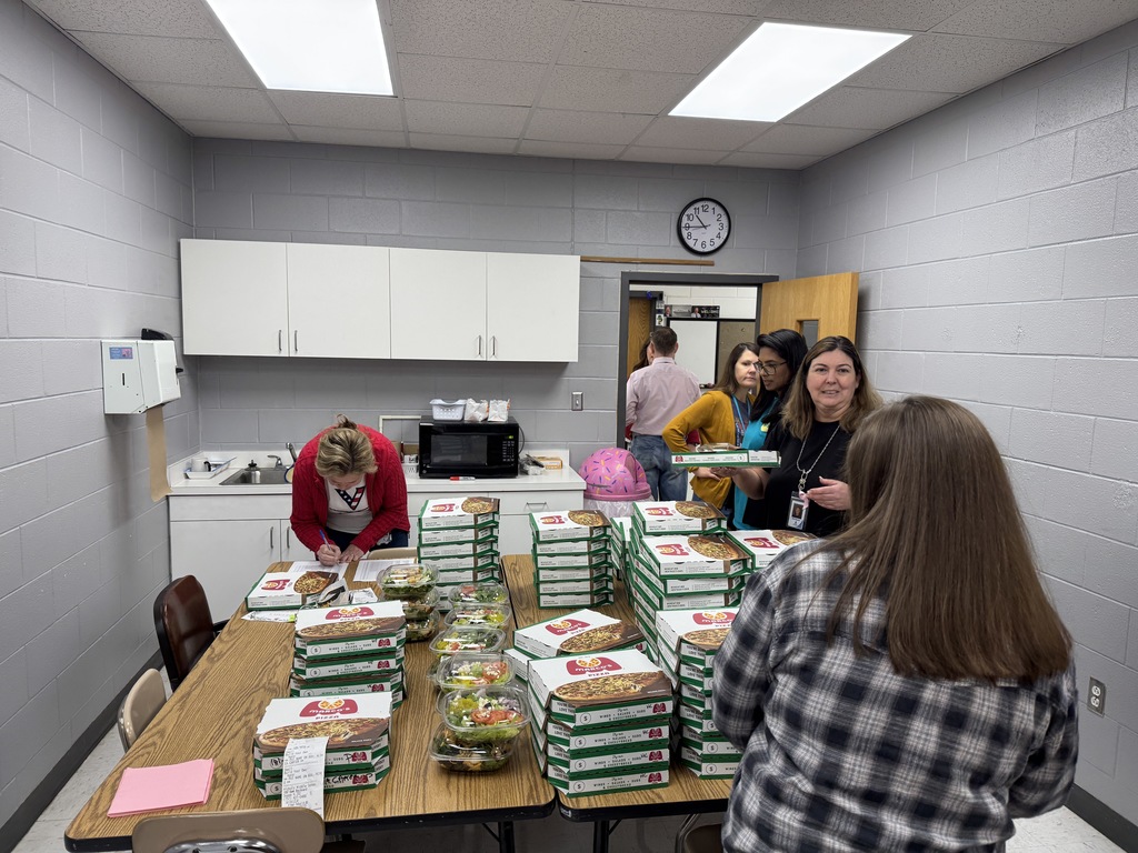 Educators with pizza from Marco's Pizza
