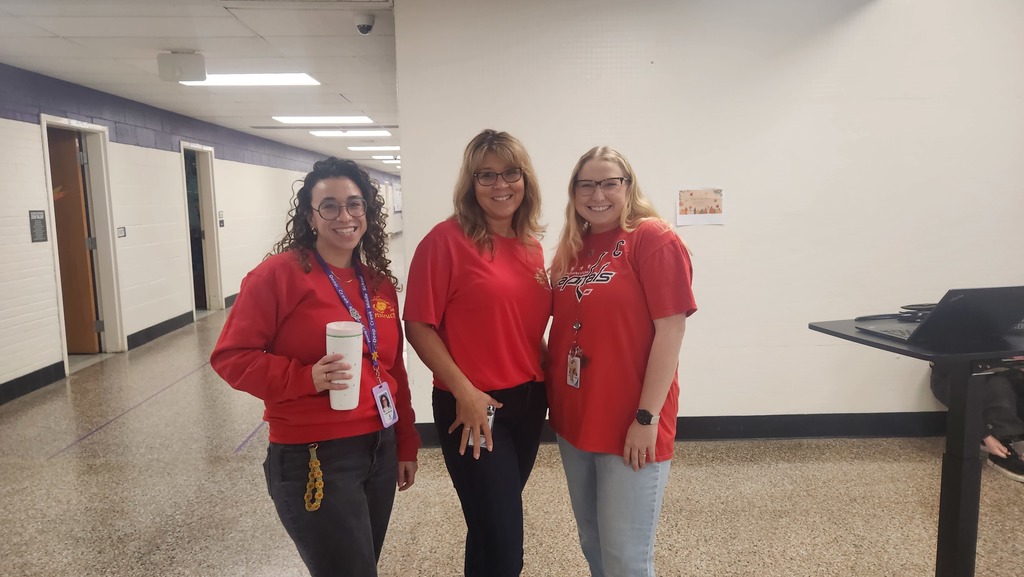 Three teachers wearing red for spirit day