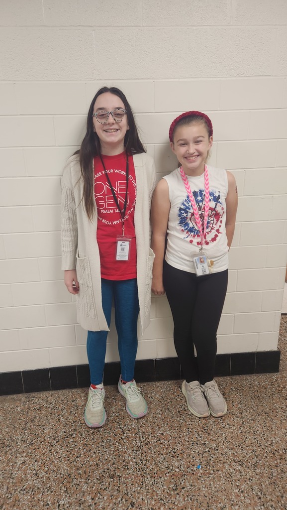 Two girls wearing red, white and blue