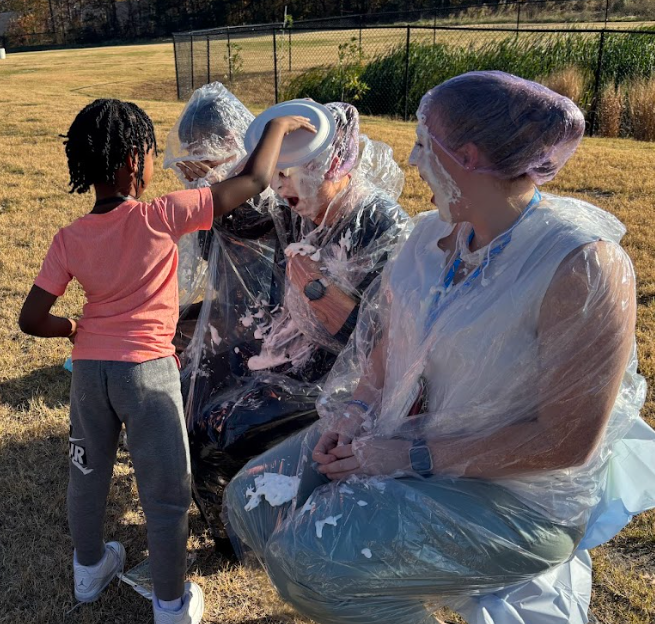 student throwing pie at teacher