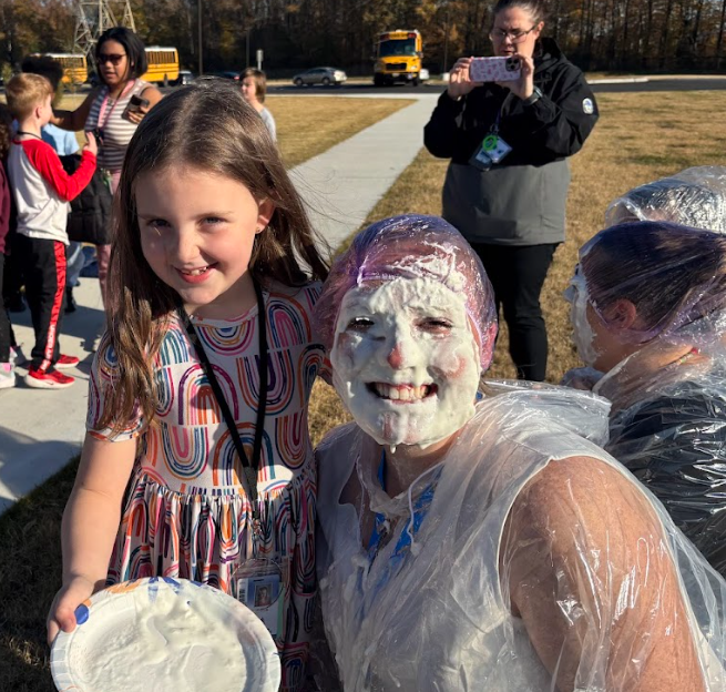 student throwing pie at teacher