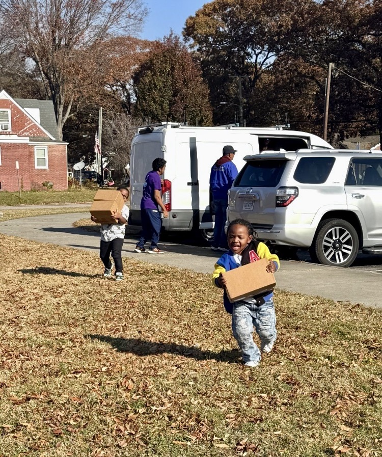 child running with box 