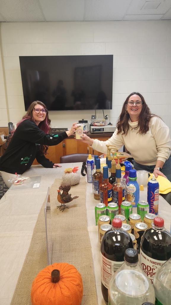 A teacher getting a soda from our volunteer