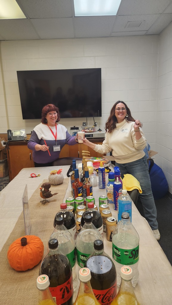 A teacher getting a soda from our volunteer